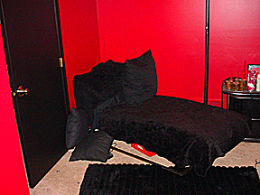 chaise lounge in red bedroom