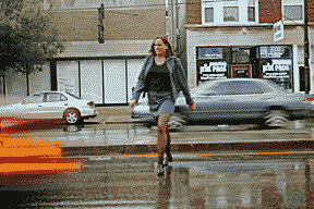 Kuypers walking outside in the rain by LaSchetts in Chicago, after her final performance at the Society of Professional Journalists poetry showcase in 2006